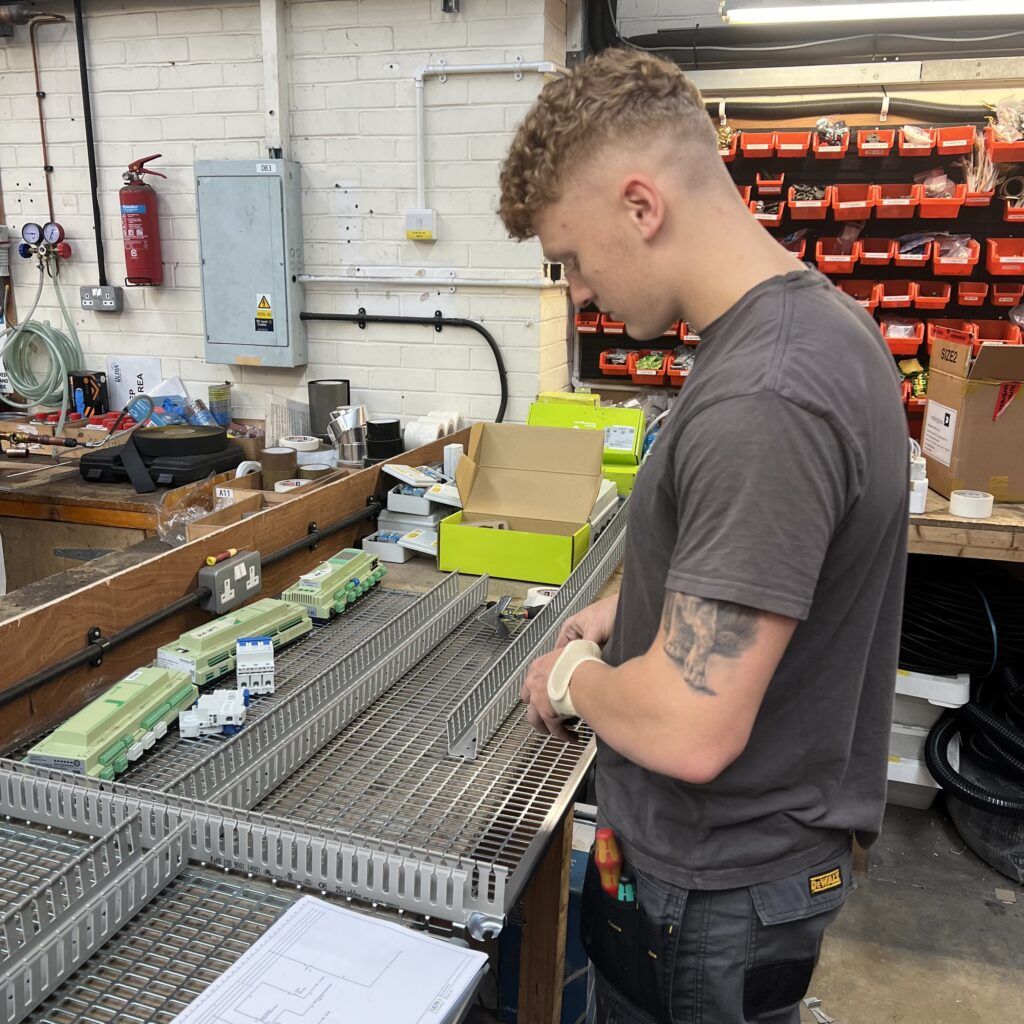 Apprentice engineer starts construction of control panel